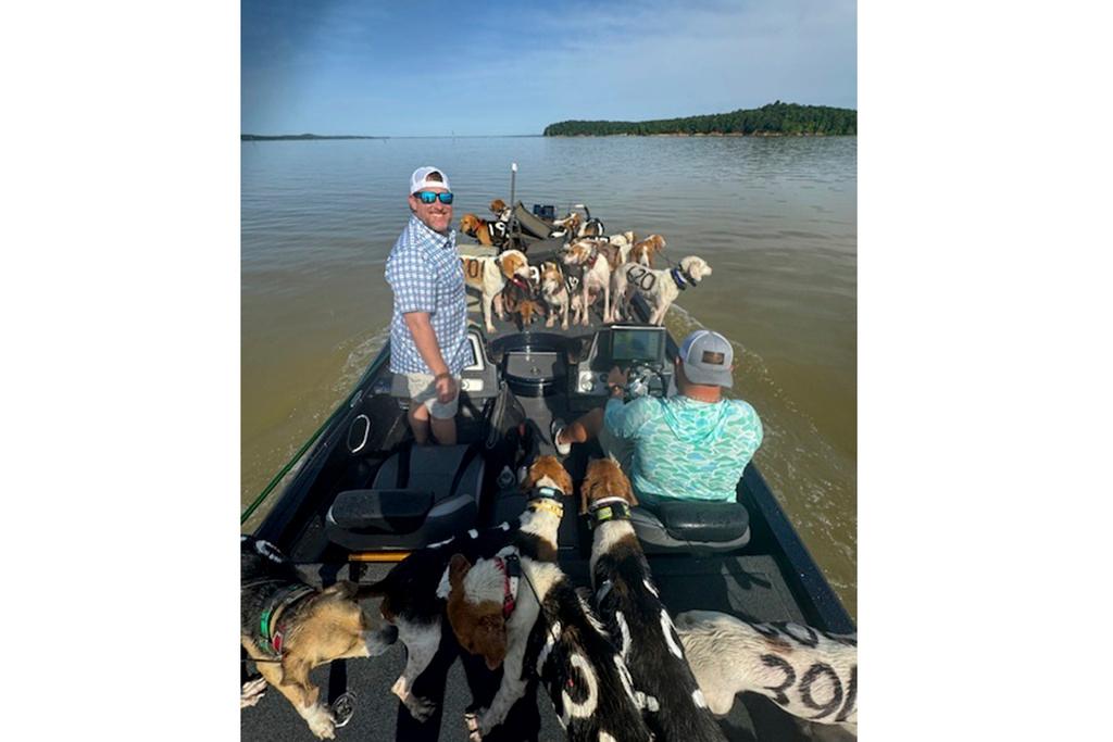 Fishermen bring one of three boatloads of dogs back to shore