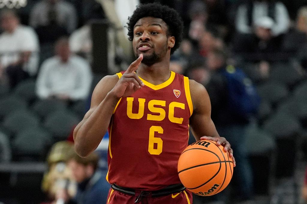 Southern California's Bronny James brings the ball up the court