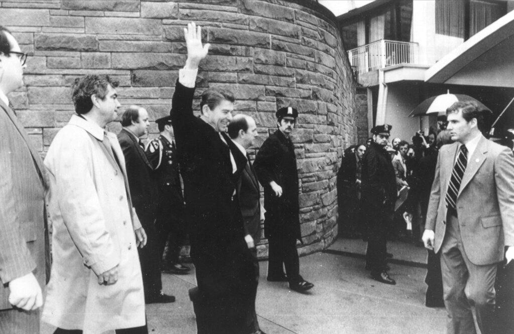  President Ronald Reagan waves just before he is shot outside the Washington Hilton in Washington. 