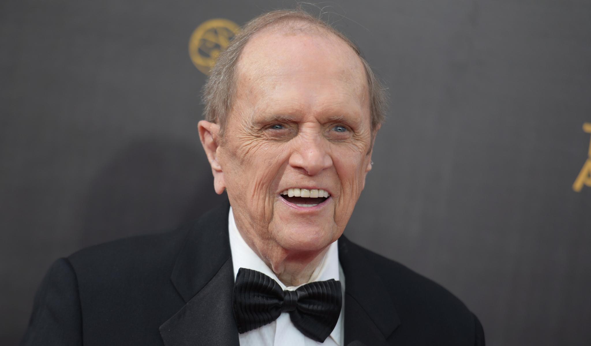 Bob Newhart in a black and white tuxedo, smiling