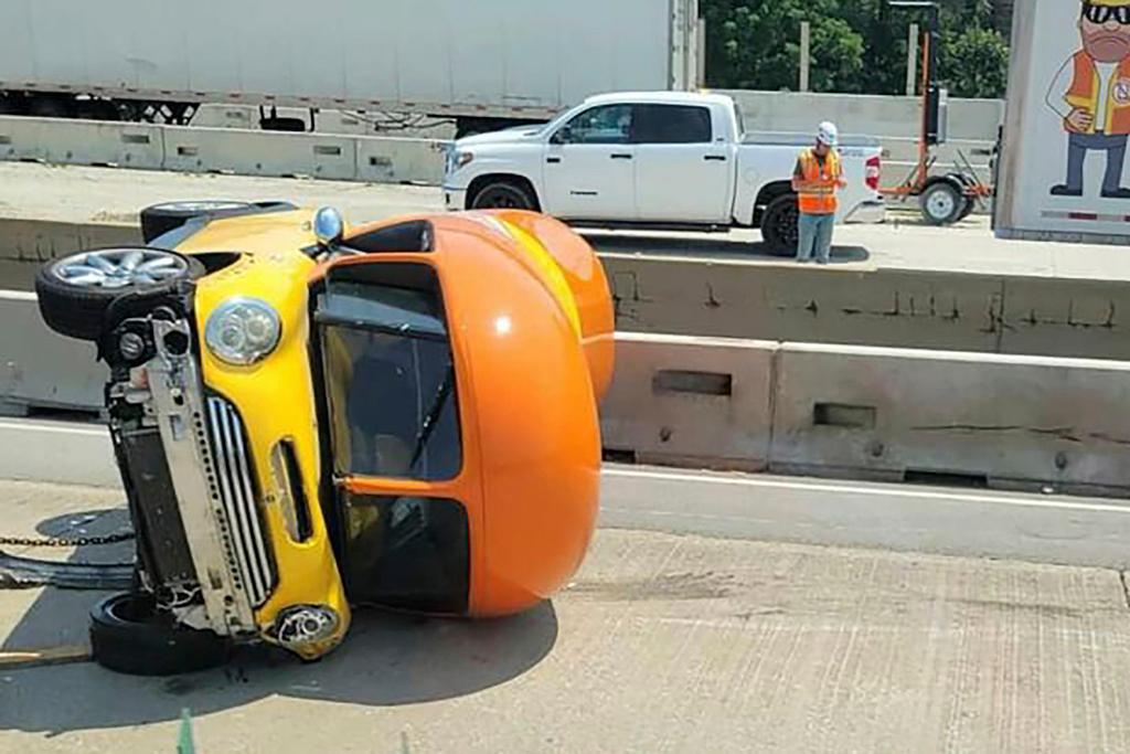 One of Oscar Mayer’s hot dog-shaped Wienermobiles is flipped onto its side after crashing along Interstate 294, a suburban Chicago highway