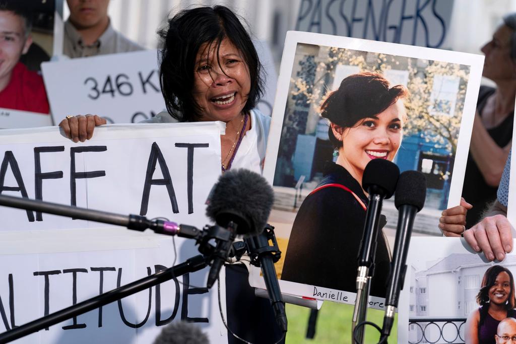  Clariss Moore, parent of Danielle, one of the crash victims of a Boeing 737 Max 8 in Ethiopia, holds her photograph while speaking at a news conference on Capitol Hill