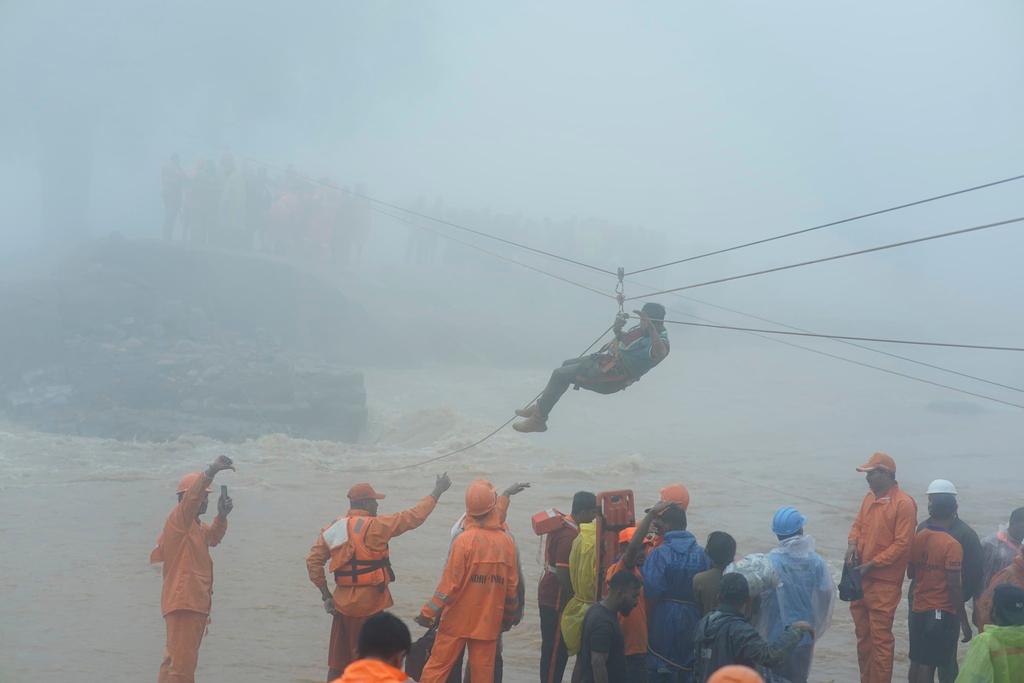 Rescuers try to reach affected people after landslides hit hilly villages in Wayanad district, Kerala state, India, Tuesday, July 30, 2024.
