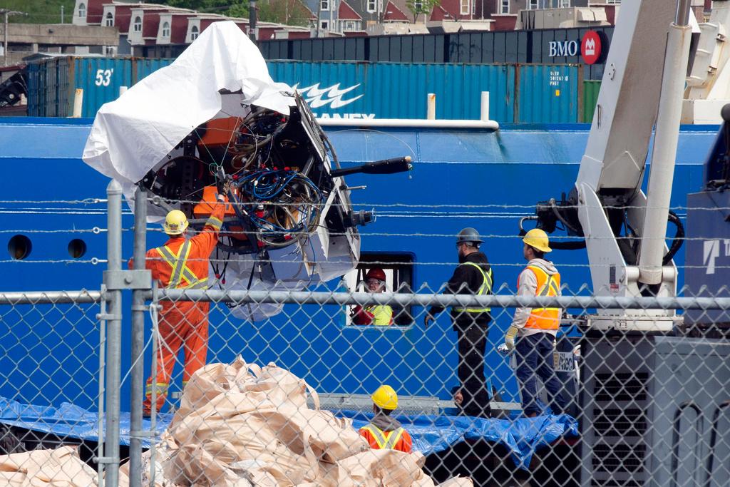 Debris from the Titan submersible, recovered from the ocean floor near the wreck of the Titanic, is unloaded from the ship Horizon Arctic at the Canadian Coast Guard pier in St. John's, Newfoundland, June 28, 2023.