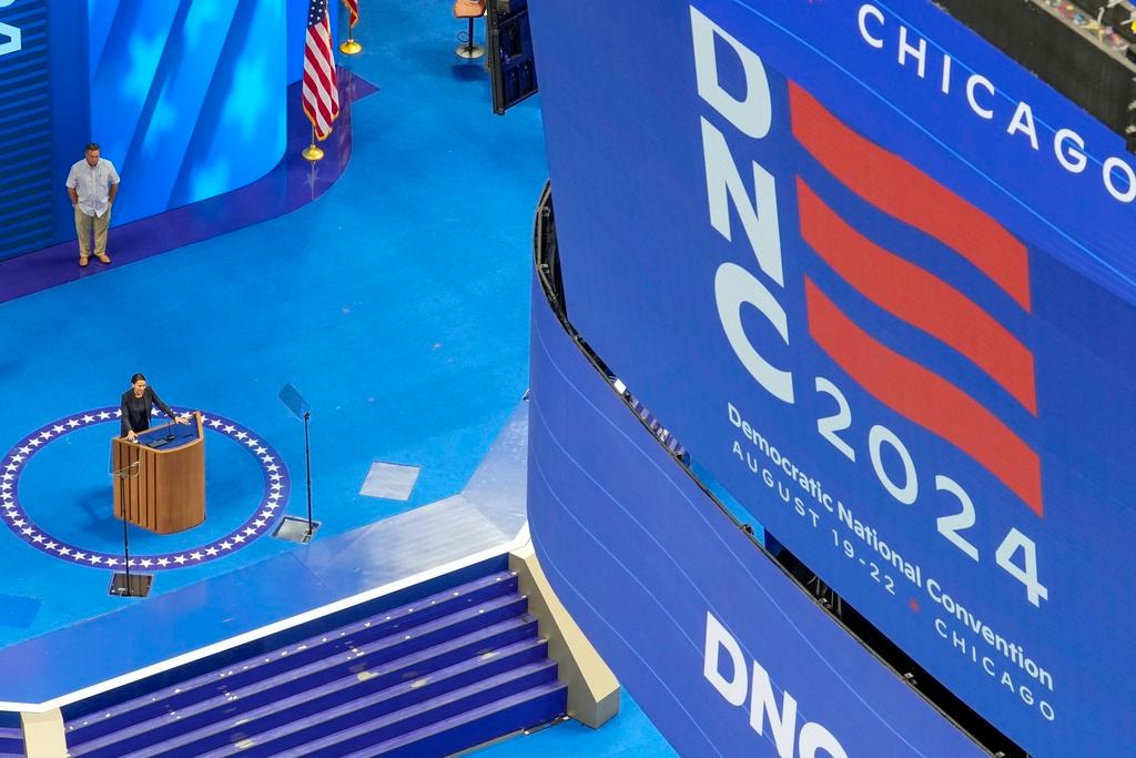 Rep. Alexandria Ocasio-Cortez, D-NY, stands at the podium at the Democratic National Convention at the United Center in Chicago