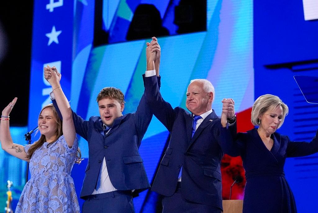 Democratic vice presidential nominee Minnesota Gov. Tim Walz celebrates with his family during the Democratic National Convention Wednesday, Aug. 21, 2024, in Chicago. 