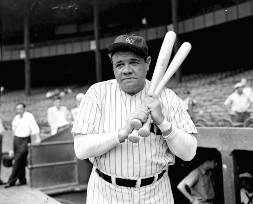 Babe Ruth warms up with three bats before stepping to the plate at New York's Yankee Stadium, August 21, 1942