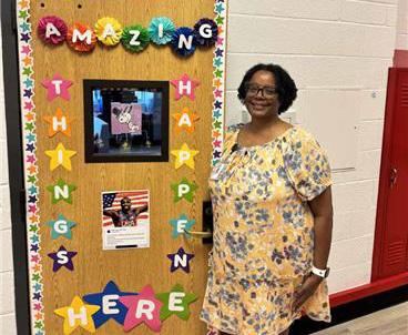 Sheridan Dixon stands at her classroom door at Hamilton Park Pacesetter Magnet in Dallas