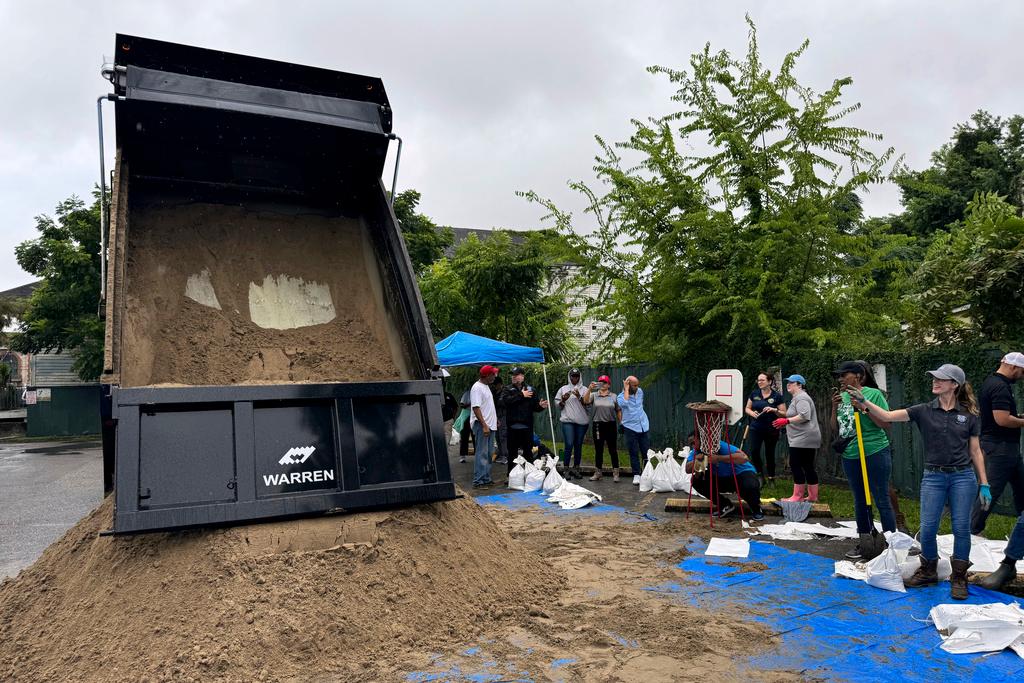 Residents fill up sandbags to protect their homes in anticipation 