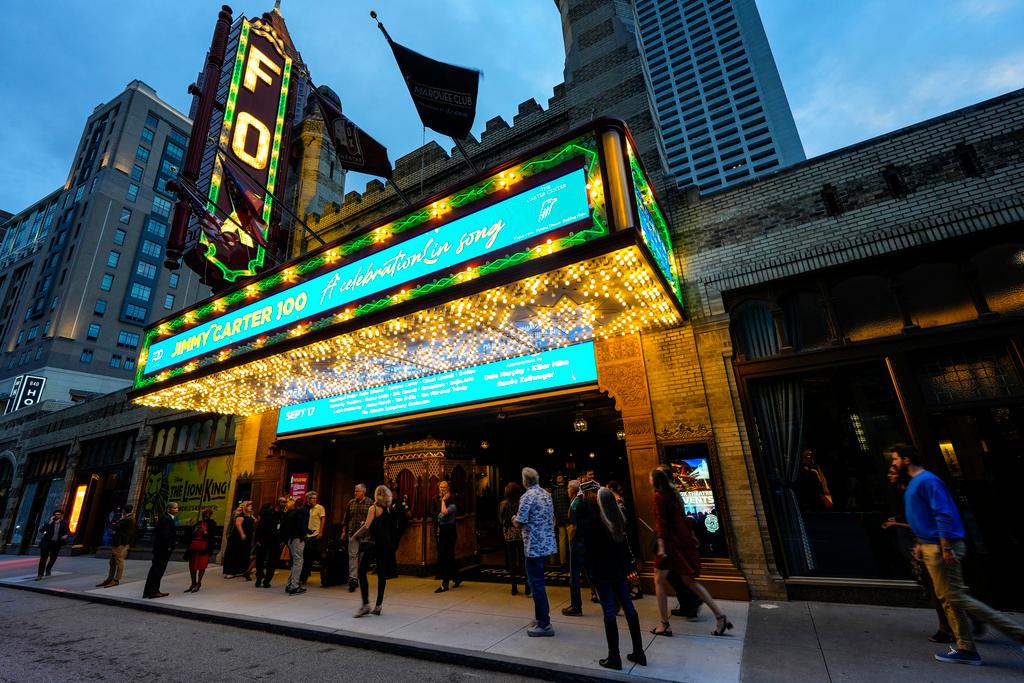 People wait in line ahead of a "Jimmy Carter 100: A Celebration in Song," concert at the Fox Theatre, Tuesday, Sept. 17, 2024, in Atlanta. Former President Carter turns 100-years old on Oct. 1.