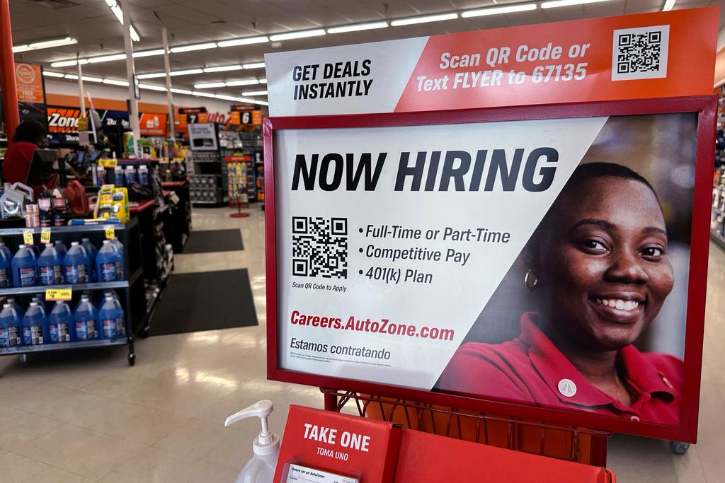 hiring sign is displayed at a retail store in Buffalo Grove, Ill., 