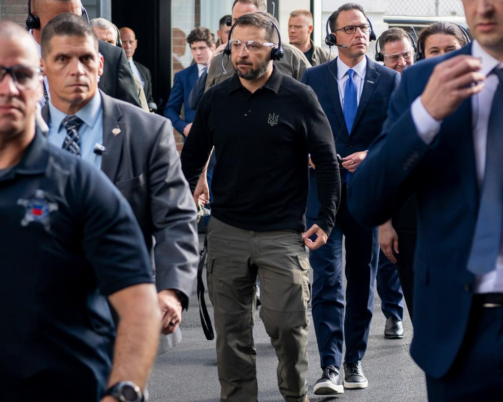 Ukrainian President Volodymyr Zelenskyy, center, tours the Scranton Army Ammunition Plant in Scranton, Pa.