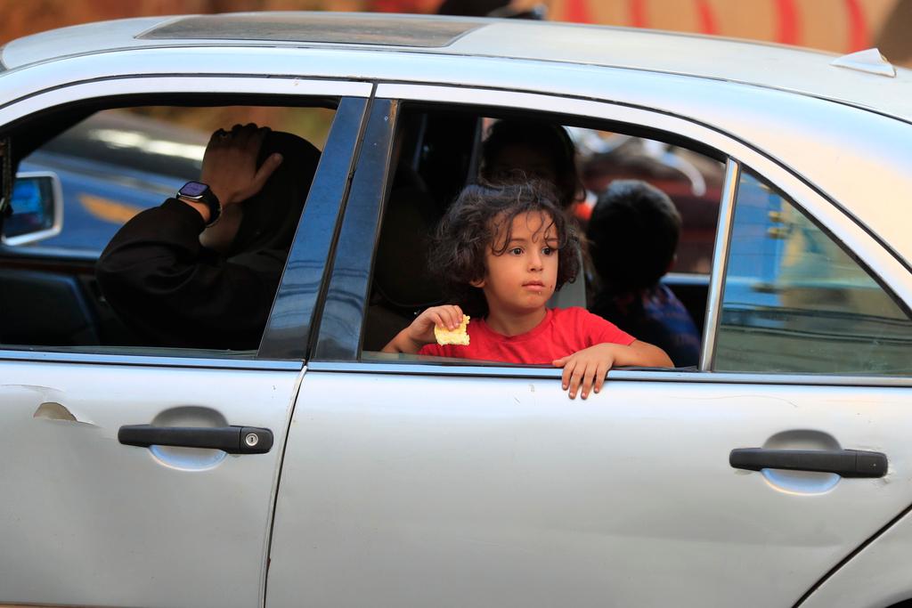 Cars sit in traffic as people flee the southern villages amid ongoing Israeli airstrikes, in Sidon, Lebanon