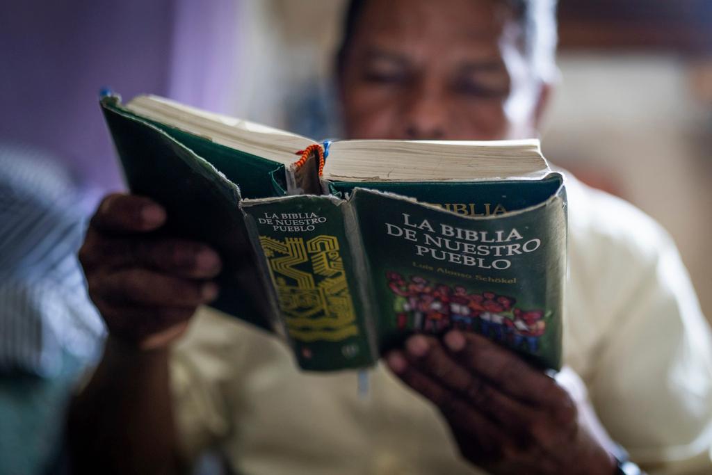 Nicaraguan exile Francisco Alvicio, a deacon of Nicaragua's Moravian Church, reads a Bible in his rented room in San Jose, Costa Rica, Sunday, Sept. 22, 2024. 