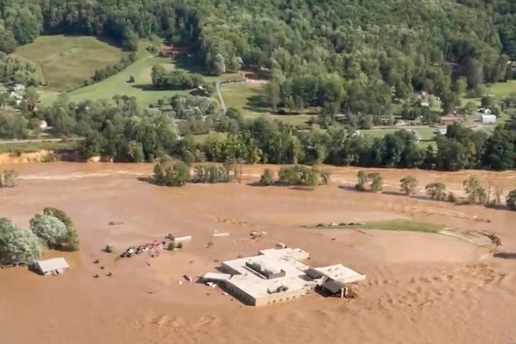 This image taken from video from the Tennessee Emergency Management Agency shows a helicopter on the roof of Unicoi County Hospital in Erwin, Tenn., where patients and staff had to be rescued from after the Nolichucky River flooded and surrounded the building from Hurricane Helene, Friday, Sept. 27, 2024.
