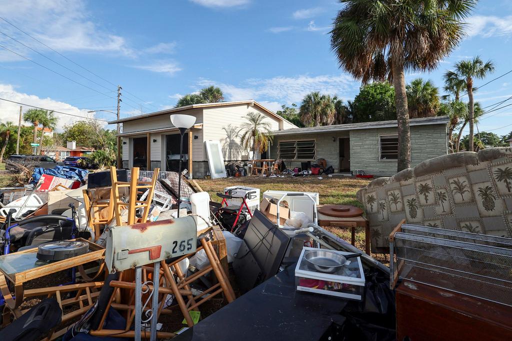 The contents of the house of Marjorie Havard, who was found deceased in the home, rests in a pile, Wednesday, Oct. 2, 2024, in Indian Rocks Beach, Fla. 