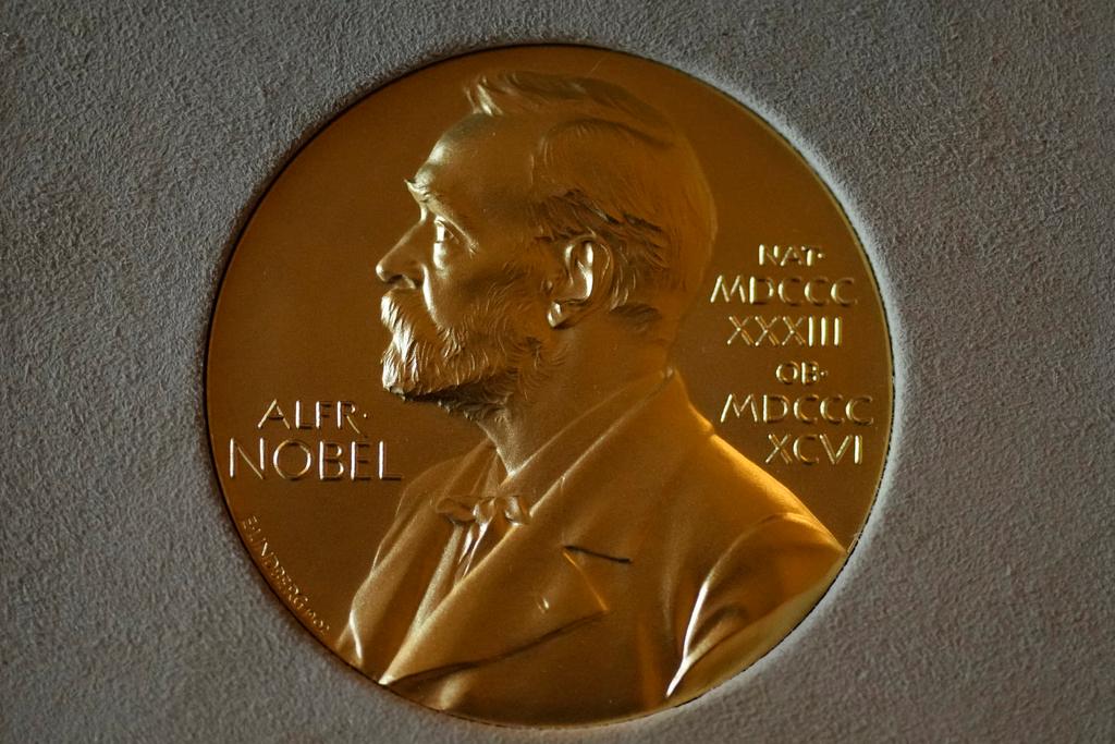 FILE - A Nobel Prize medal is displayed before a ceremony at the Swedish Ambassador's Residence in London, Monday, Dec. 6, 2021. 