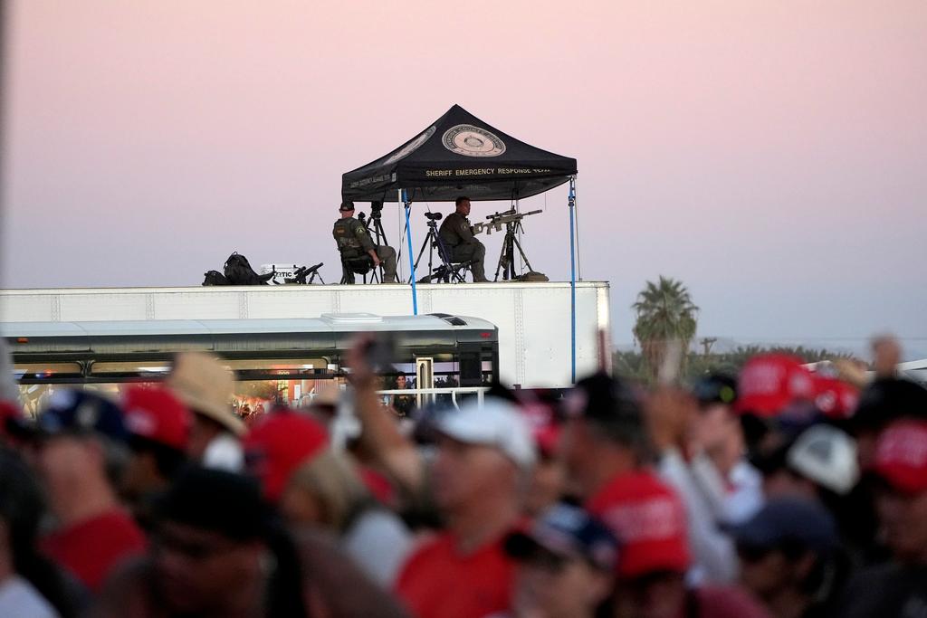 Law enforcement snipers look over the scene as Republican presidential nominee former President Donald Trump speaks at a campaign rally at the Calhoun Ranch in Coachella, Calif.
