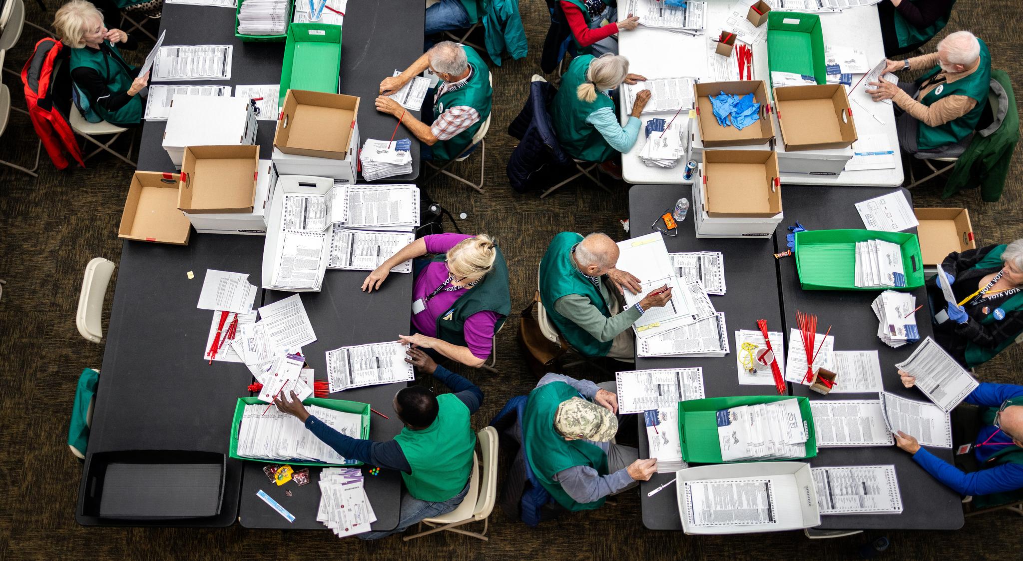 Poll workers counting ballots