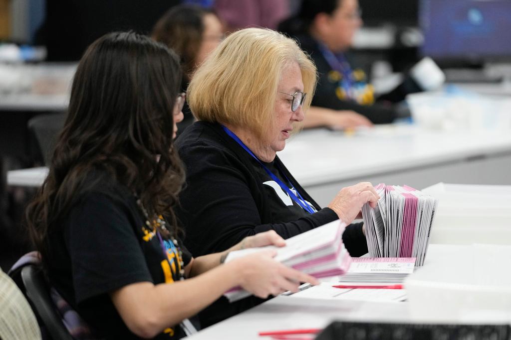 Election workers process ballots at the Washoe County Registrar of Voters Office, Tuesday, Nov. 5, 2024, in Reno, Nev. 
