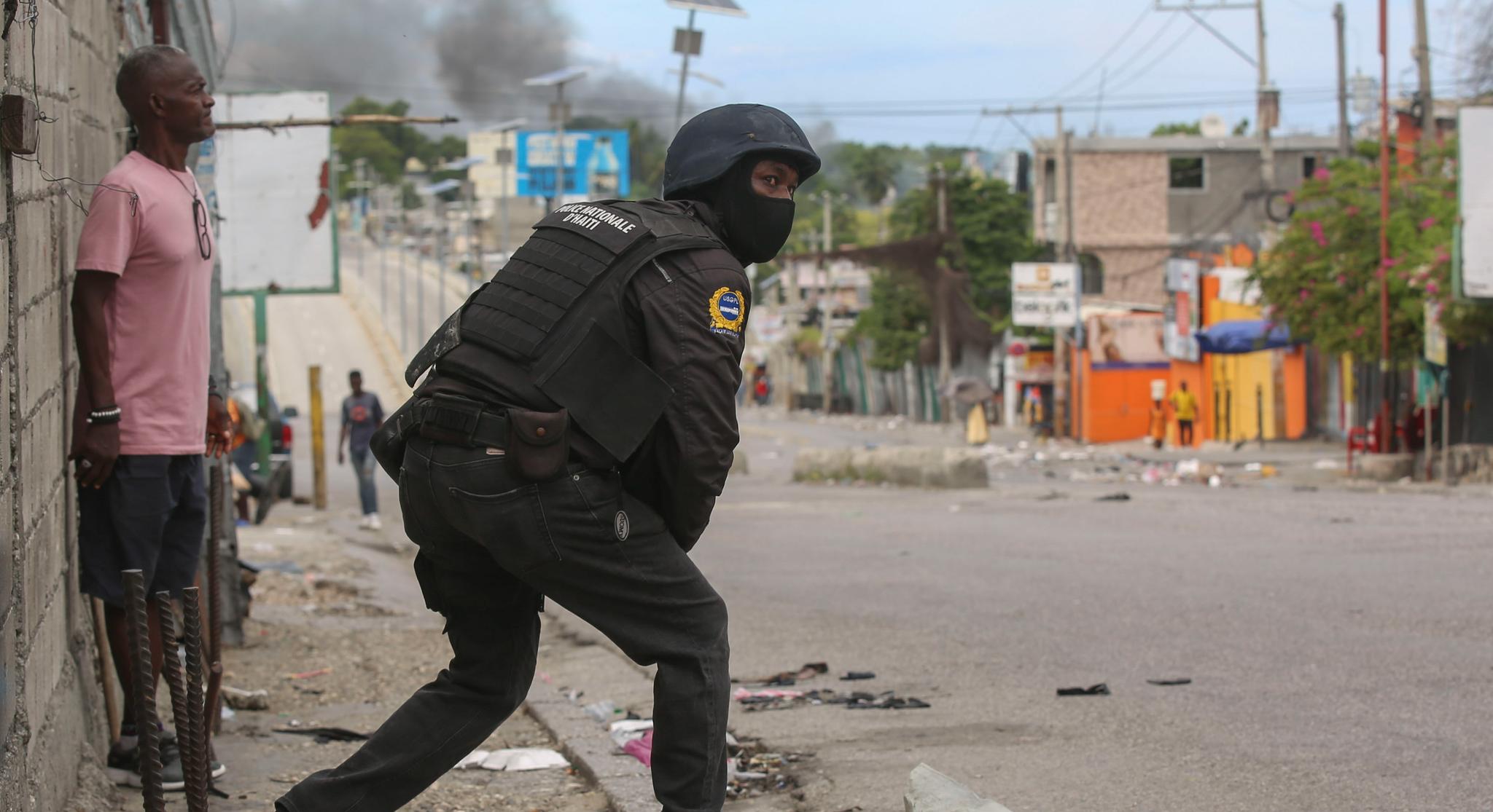 Haiti police in a rough area