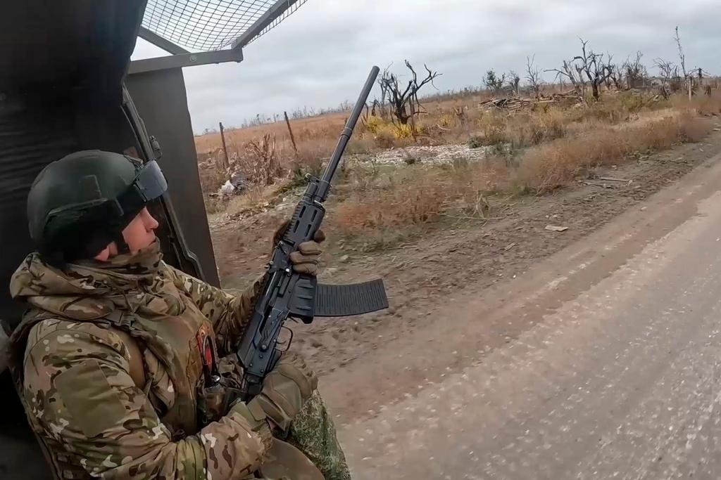 In this photo taken from a video released by Russian Defense Ministry Press Service on Friday, Nov. 22, 2024, a Russian engineer troops serviceman operates at an undisclosed location in Ukraine.