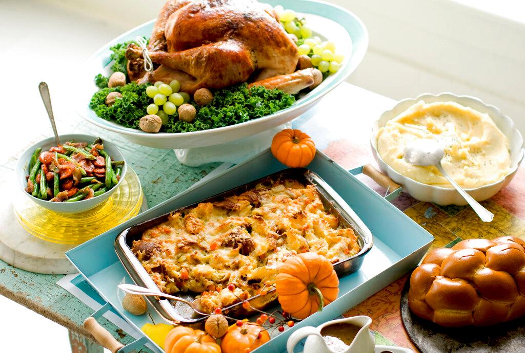 In this image taken on Oct. 2, 2012, plain Jane turkey and gravy, cheesy stuffing, buttery mashed potatoes, sweet and sour glazed carrots, and green beans are shown in Concord, N.H. 