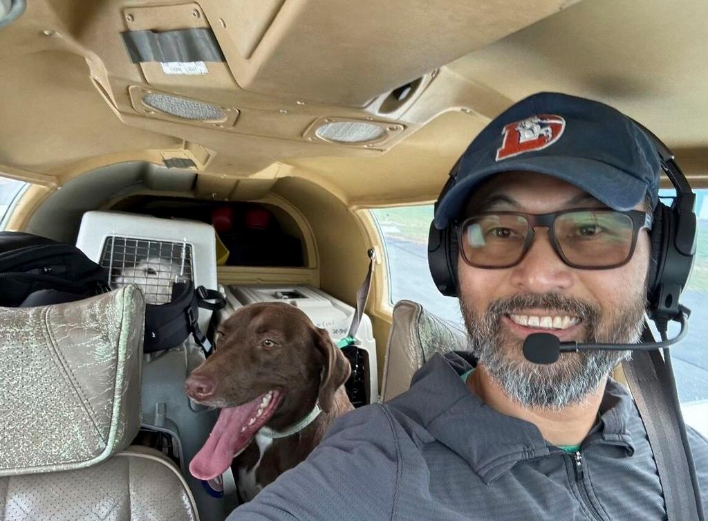  Seuk Kim during a flight to deliver dogs rescued from an euthanasia list 