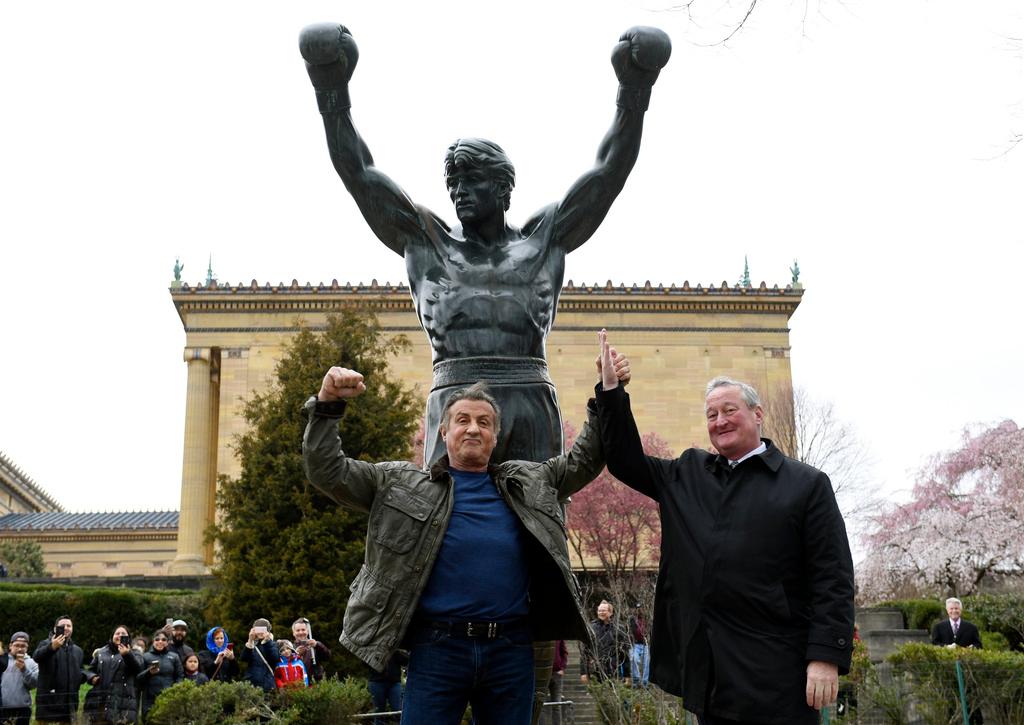 Sylvester Stallone, left, poses with Philadelphia Mayor Jim Kenney in front of the Rocky statue at the Philadelphia Art Museum for a "Creed II" photo op, April 6, 2018