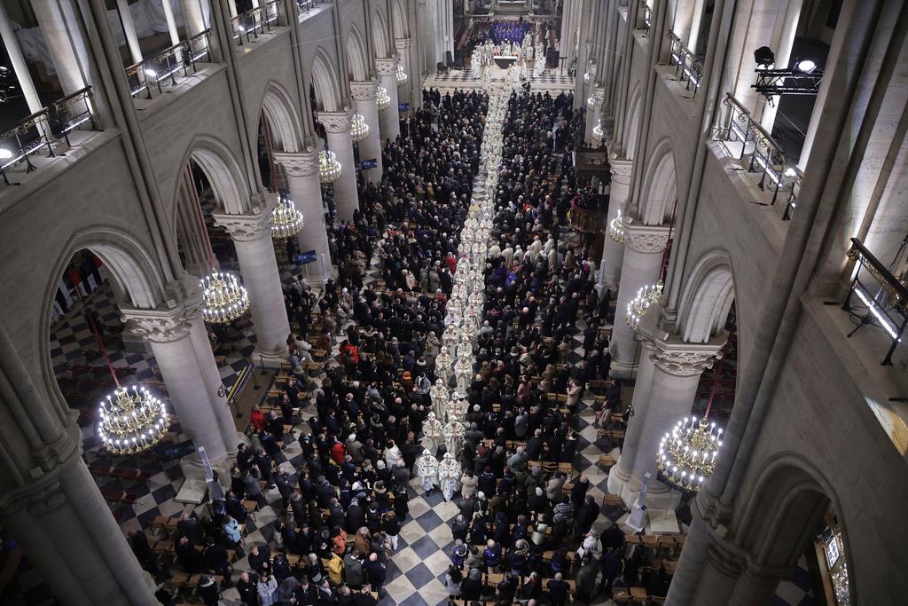 Clergymen leave Notre Dame Cathedral after the inaugural mass at Notre Dame Cathedral, hosting its first Mass since the catastrophic fire of 2019,, Sunday, Dec. 8, 2024 in Paris. 