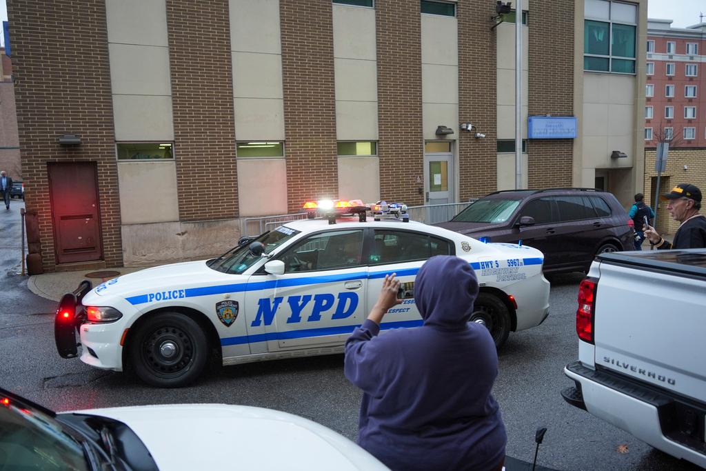 New York Police officers arrive at Altoona Police Department, where a man with a gun thought to be similar to the one used in the killing of UnitedHealthcare CEO Brian Thompson has been taken into police custody for questioning, Monday, Dec. 9, 2024, in Altoona, Pa.