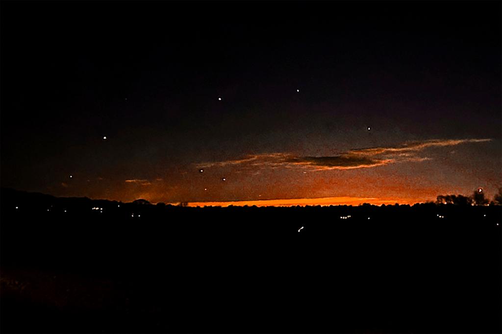 Evening sky and points of light near in Lebanon Township, N.J.