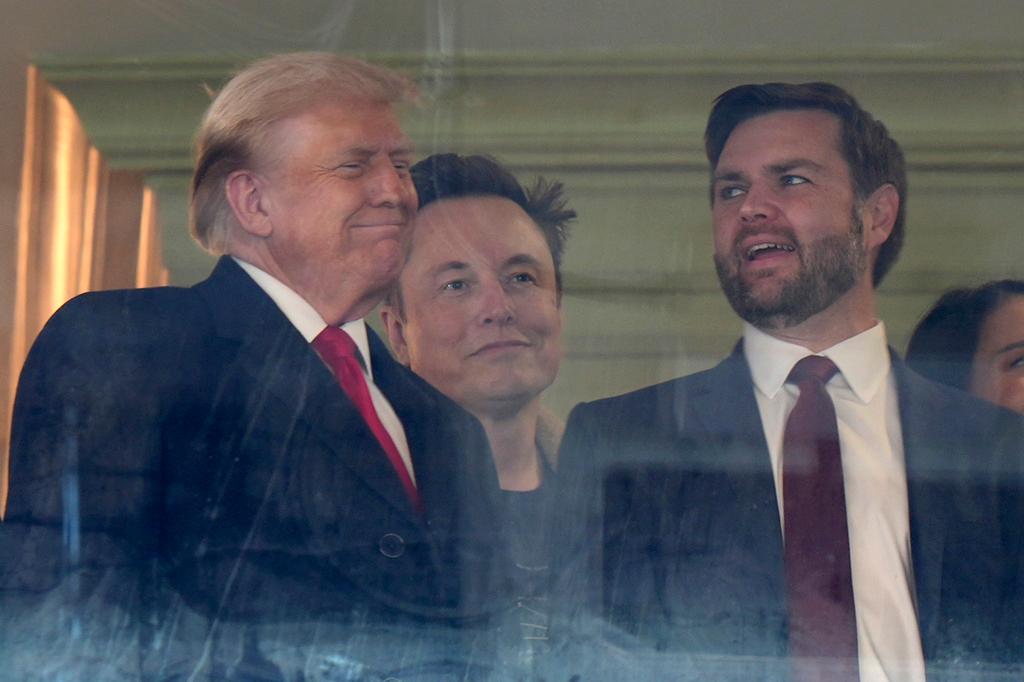 President-elect Donald Trump, from left, Trump's pick for the planned Department of Government Efficiency Elon Musk and Vice President-elect JD Vance attend the NCAA college football game between Army and Navy at Northwest Stadium in Landover, Md.