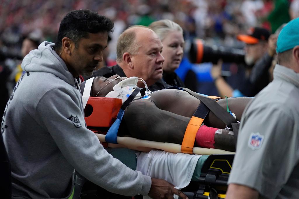 Miami Dolphins wide receiver Grant DuBose (88) is carted off the field