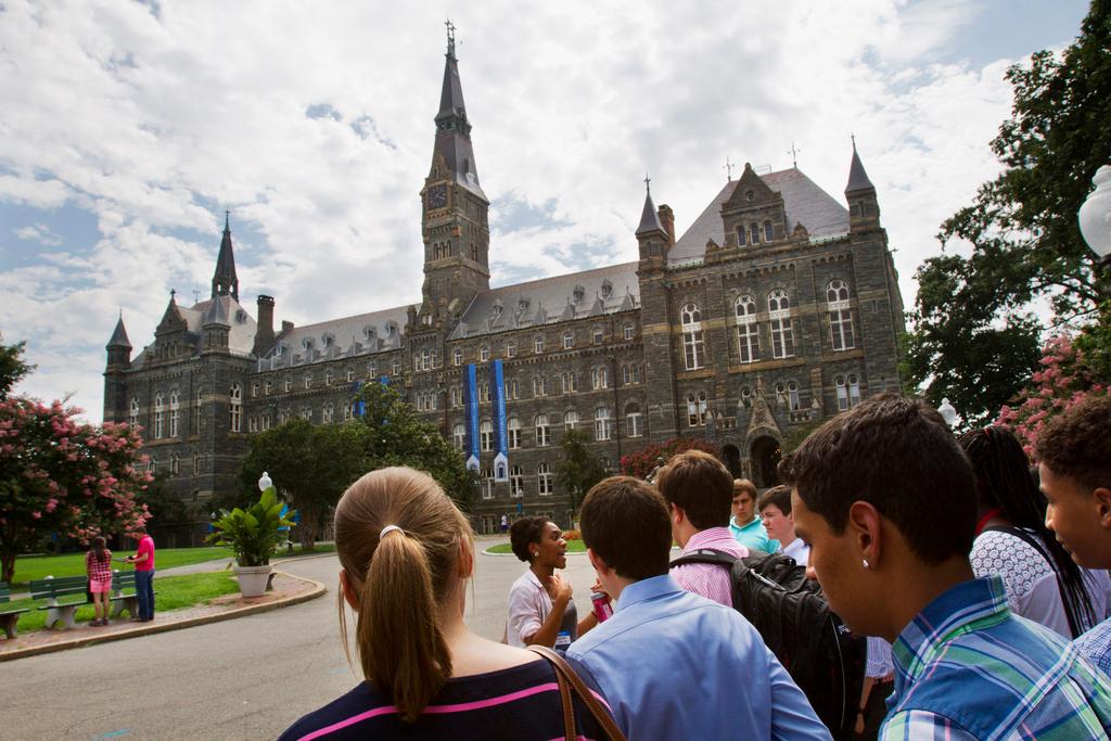 Prospective students tour Georgetown University's campus in Washington