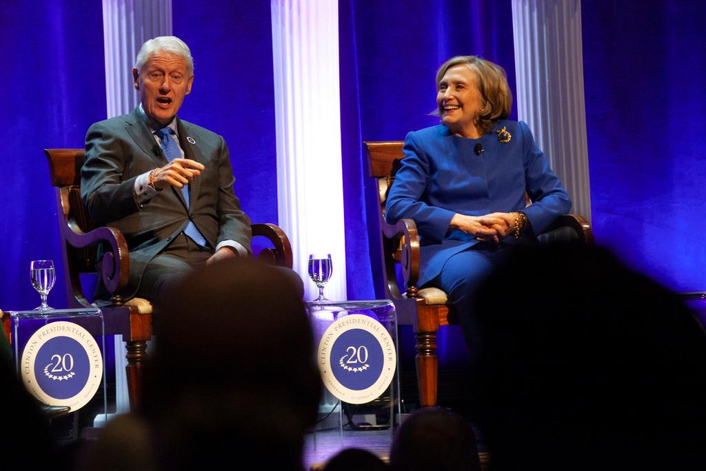 Former President Bill Clinton and former Secretary of State Hillary Rodham Clinton respond to audience questions on Saturday, Dec. 7, 2024 at the Robinson Center auditorum in Little Rock, Ark.