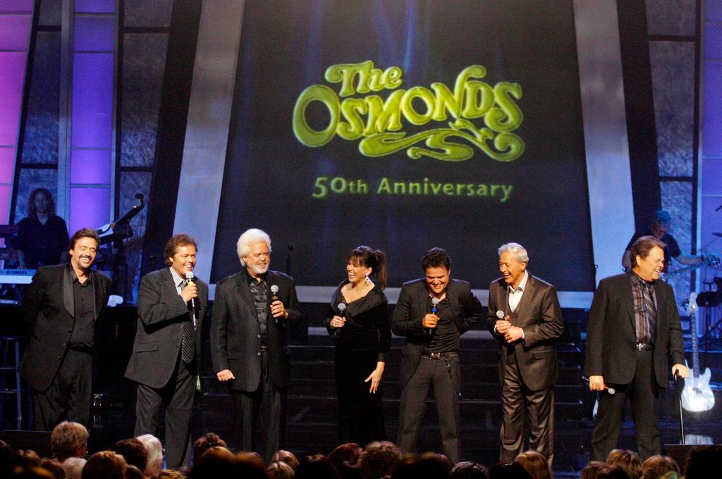 The Osmonds from left, Jay, Jimmy, Merrill, Marie, Donny, Wayne, and Alan perform during a taping of their 50th anniversary show (2007)
