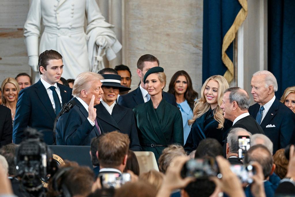 President-elect Donald Trump takes the oath of office during the 60th Presidential Inauguration
