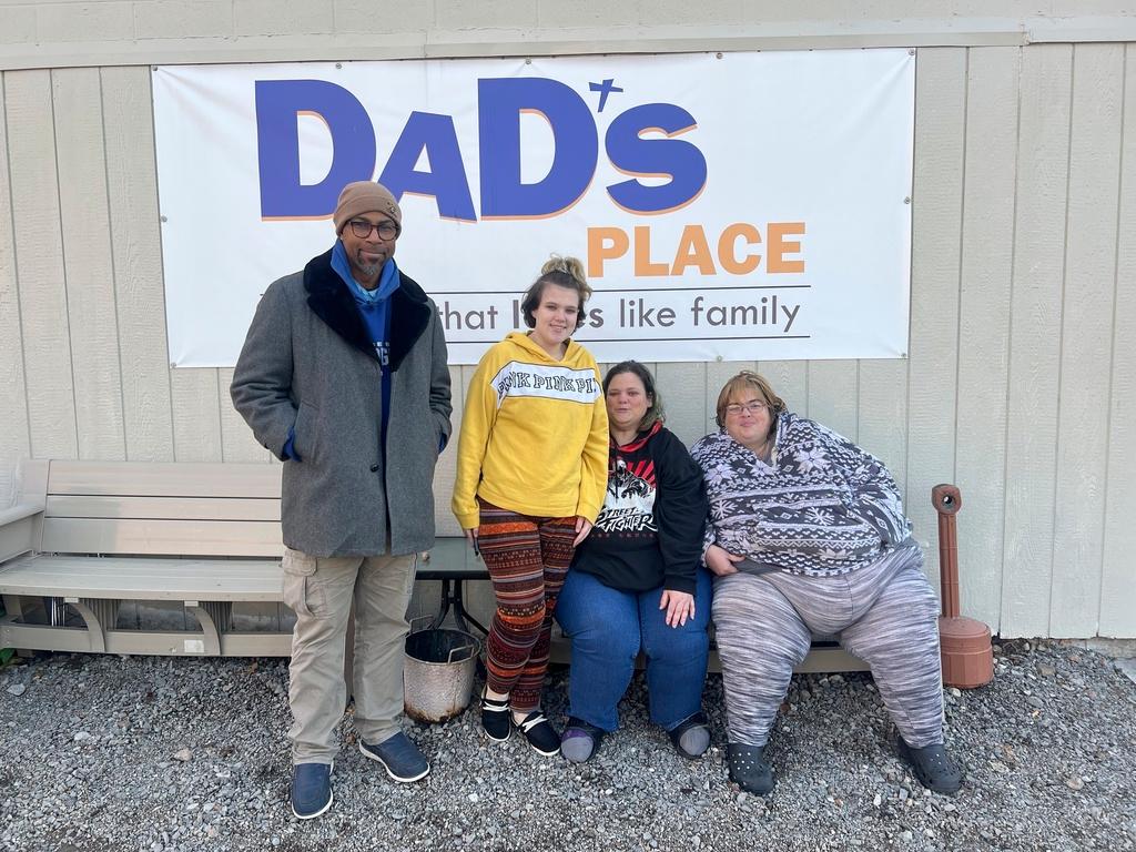 David Wright, from left, Sydney Davis, Christi Davis and Jessie Roberts outside Dad's Place church where they have sought shelter, in Bryan, Ohio