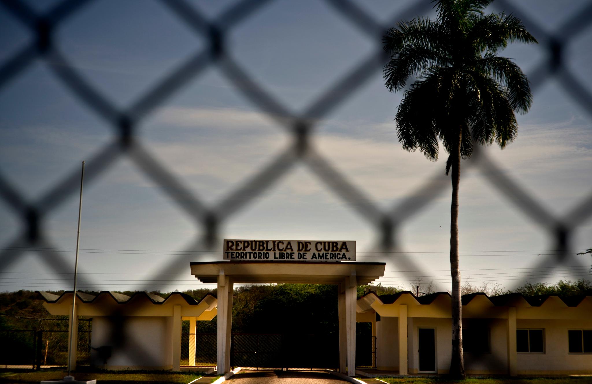 Small building behind a wire fence