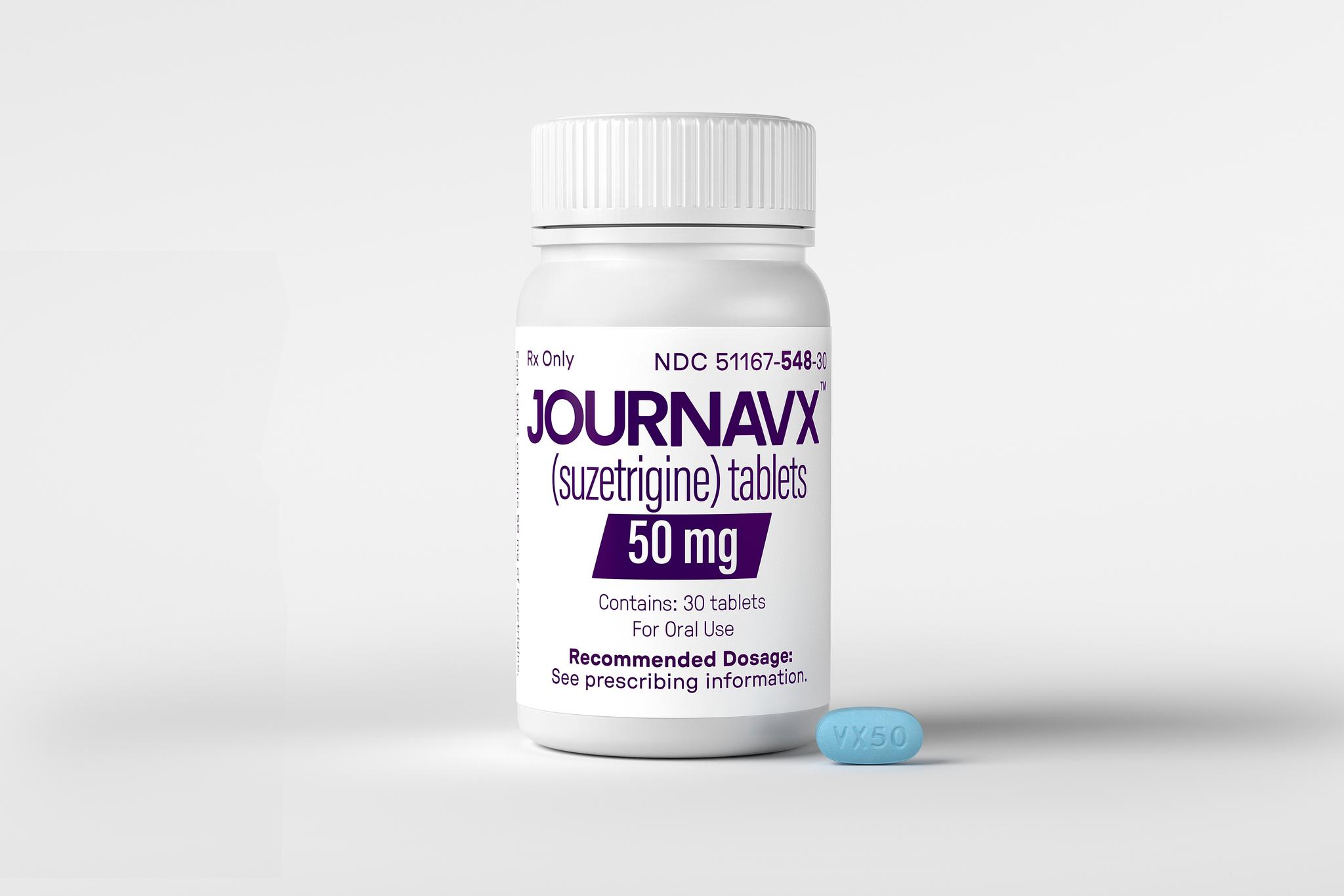 Pill bottle with one blue pill next to it