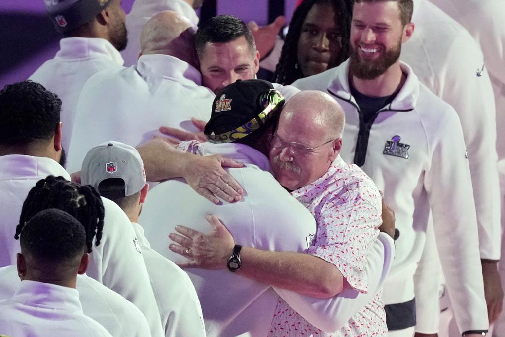 Kansas City Chiefs coach Andy Reid, right, hugs Philadelphia Eagles' Brandon Graham during Super Bowl 59 Opening Night in New Orleans
