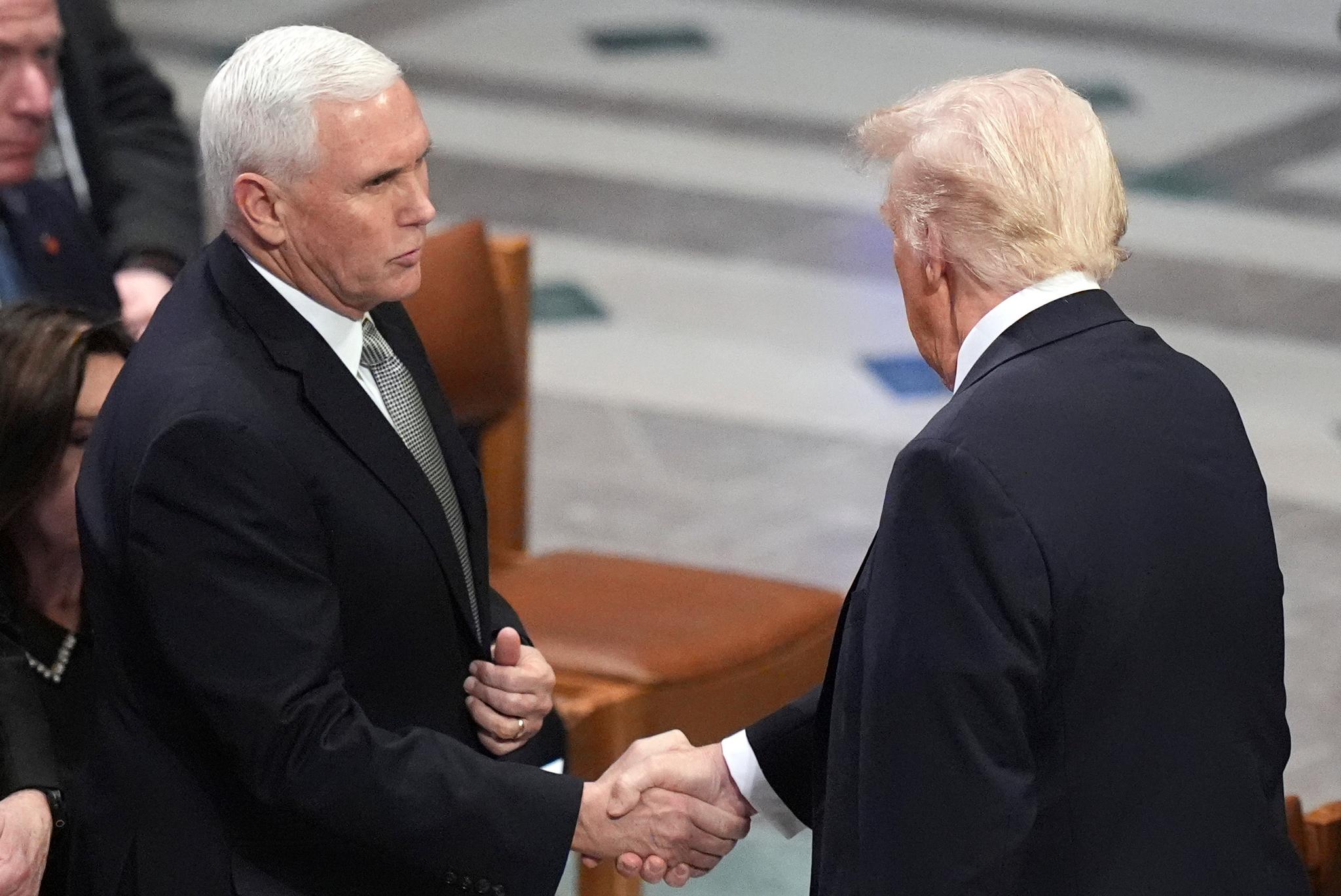 Former VP Mike Pence shaking Pres. Trump's hand at a funeral