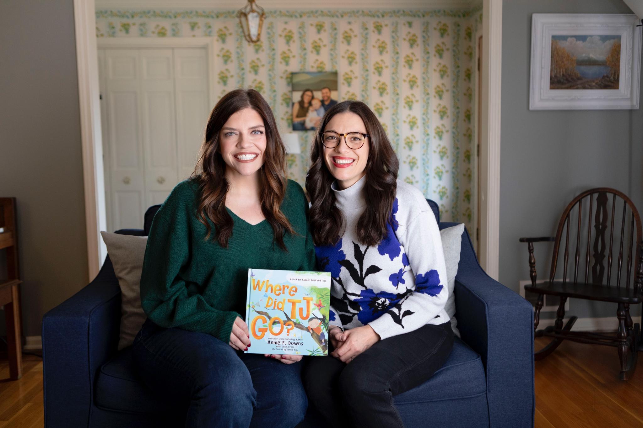 Annie F. Downs (left) and her sister, Tatum Green (right) posing with their new book, "Where Did TJ Go?"