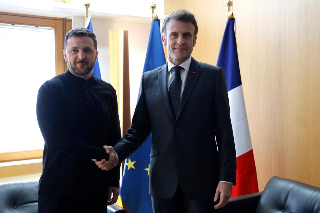 Ukraine's President Volodymyr Zelenskyy, left, and French President Emmanuel Macron on the sidelines of the European Council