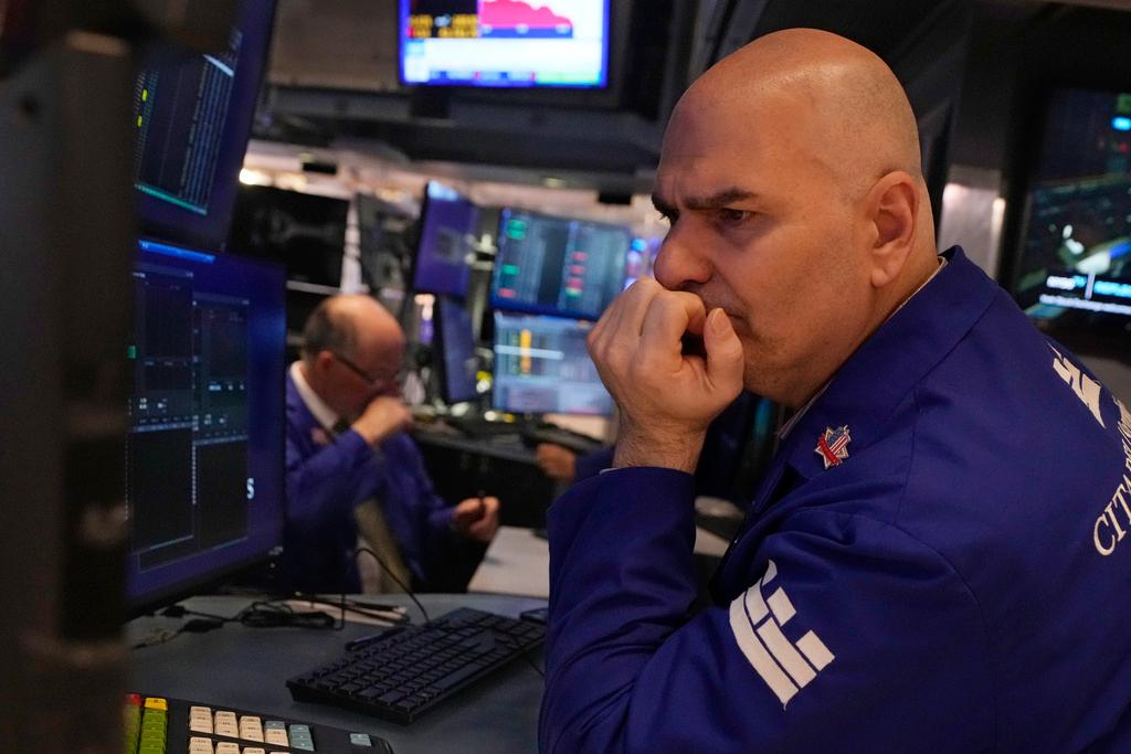 Specialist Philip Finale works on the floor of the New York Stock Exchange