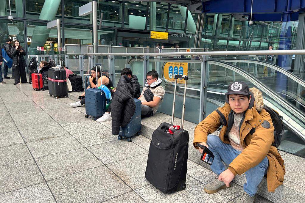 Travelers waiting at Britain's Heathrow Airport 