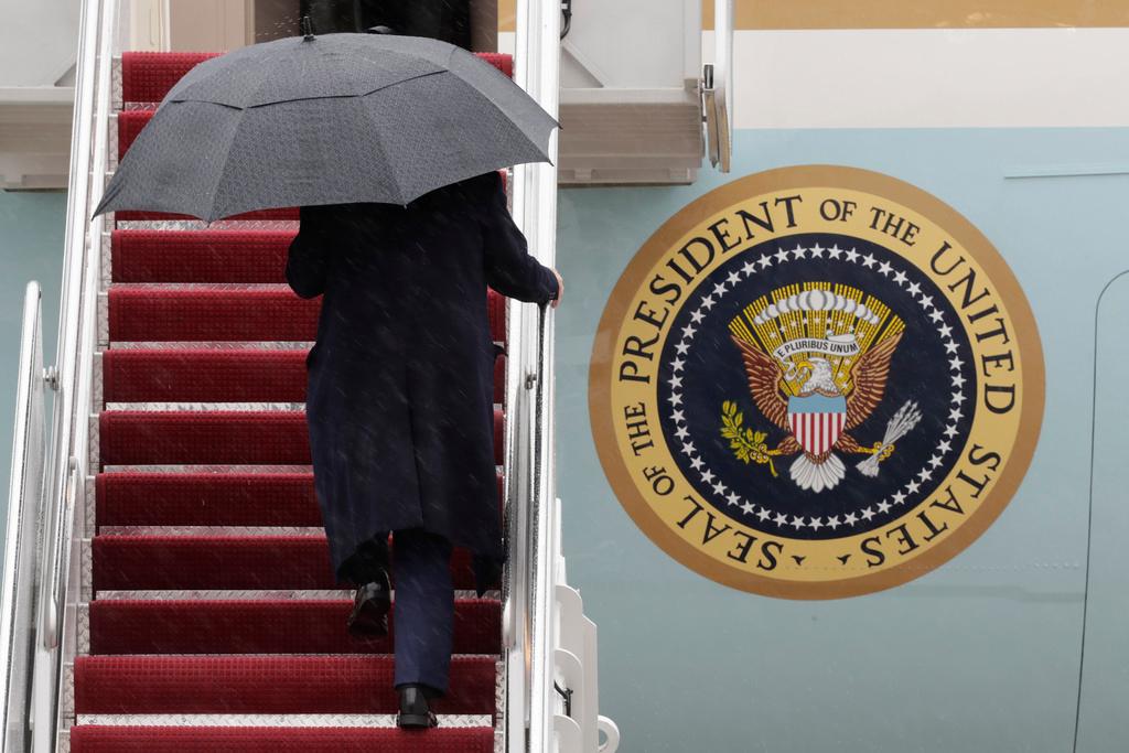 President Donald Trump walks up the stairs of Air Force One upon his arrival at Joint Base Andrews, Md.