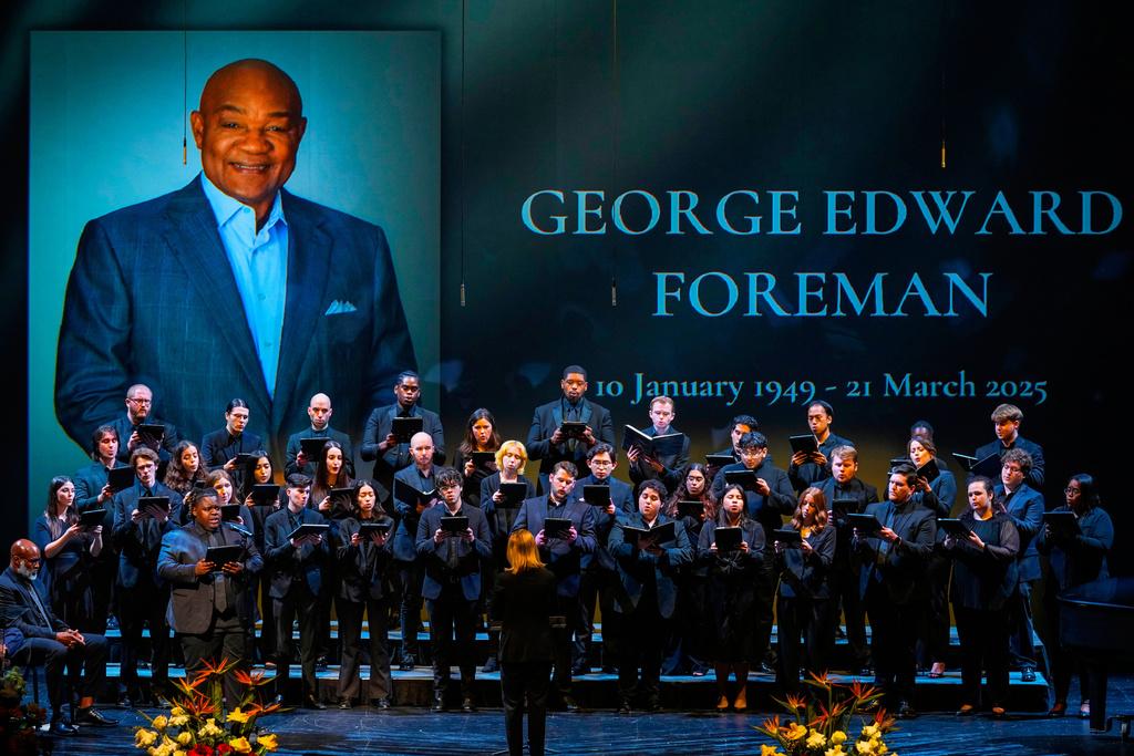 The University of Houston Choir sings "If I Can Help Somebody" during a memorial service for Olympic and world champion boxer and minister George Foreman at Wortham Theater Center in Houston