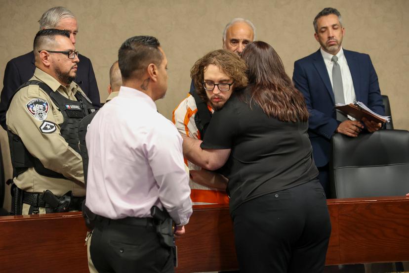 Adriana Zandri, widow of Ivan Manzano killed during the Walmart mass shooting, hugs defendant Patrick Crusius during a plea hearing in El Paso, Texas